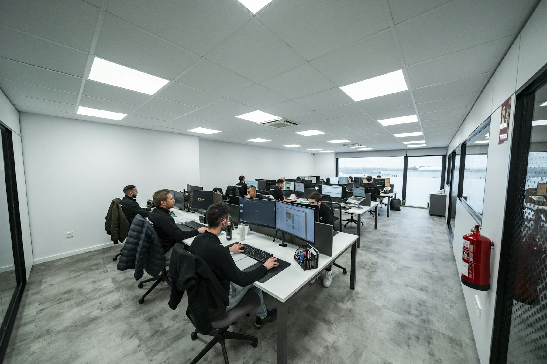 A software team collaborating in a working office